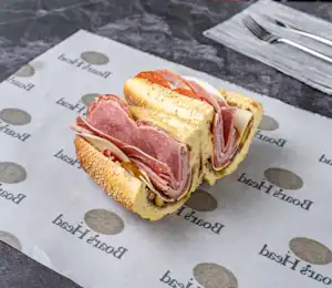 A sandwich on top of a paper wrapper.