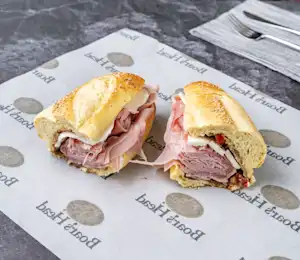 A sandwich cut in half sitting on top of a table.